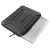 Srebrny laptop wsuwany do wnetrza czarnego etui Ranger-X Tactical przez otwarty zamek