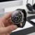 Galaxy Watch 8 w etui Tech-Protect Defense trzymany w dłoni