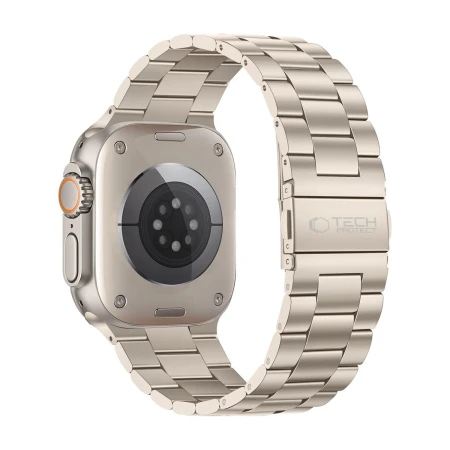 Tył Apple Watch Ultra i bransoleta Stainless Starlight ze składanym zapięciem