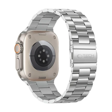 Tył Apple Watch Ultra i srebrna bransoleta Stainless ze składanym zapięciem