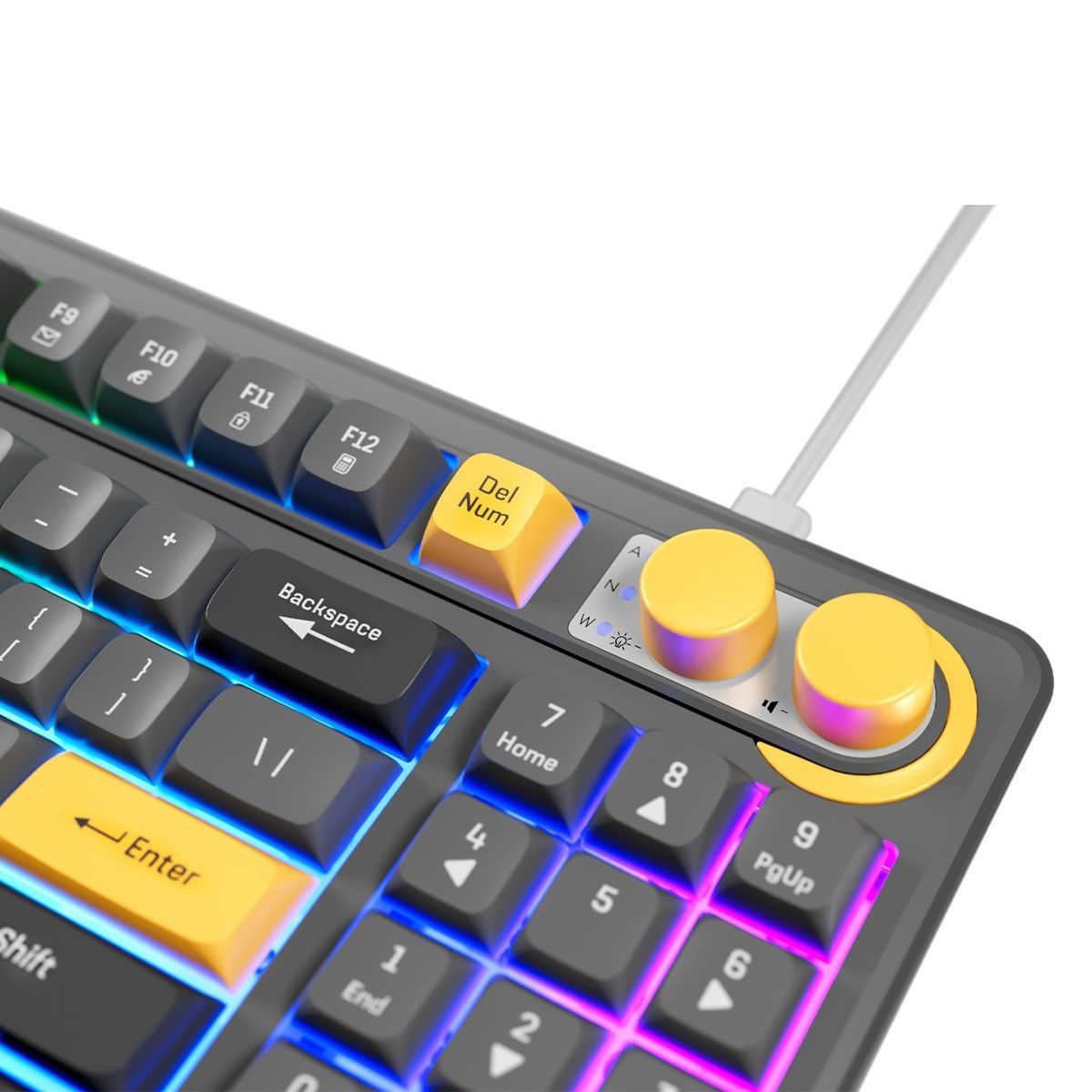 Zbliżenie na prawy górny róg: pokrętło i przyciski funkcyjne, obok klawisze z podświetleniem RGB